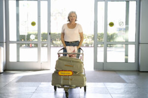 Automatic slide door woman walking with luggage